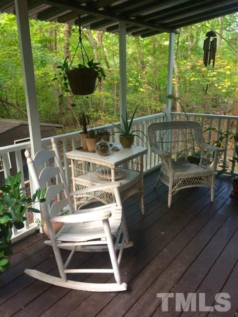 377 Booth Road Chapel Hill, NC 27516 - Photo 17 of 22 Covered deck and open deck areas in back allow for some outdoor enjoyment.