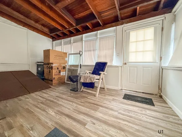 a living room with fireplace furniture and a flat screen tv