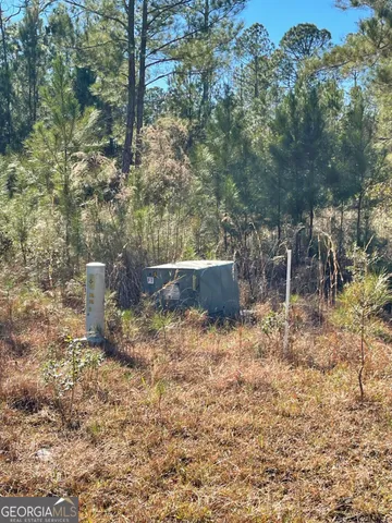 a backyard of a house with yard and outdoor seating