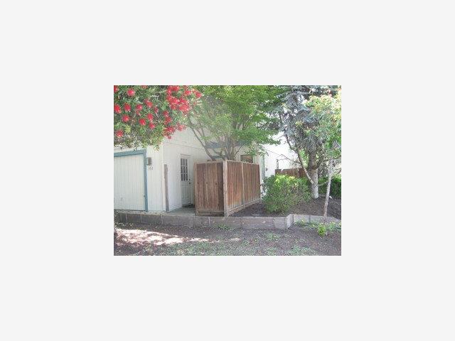 a picture of a bench in front of a building