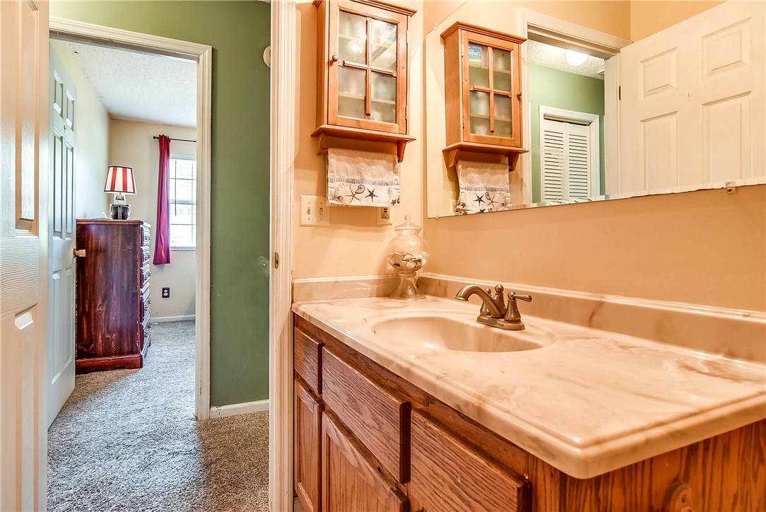 54014 Vikki Road Callahan, FL 32011 - Photo 20 of 29 a bathroom with a sink and a mirror