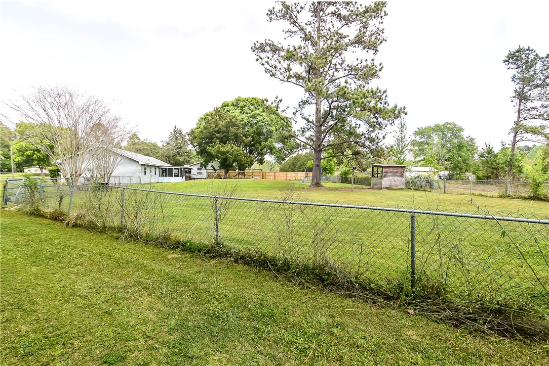 54014 Vikki Road Callahan, FL 32011 - Photo 25 of 29 a view of a field of grass and trees