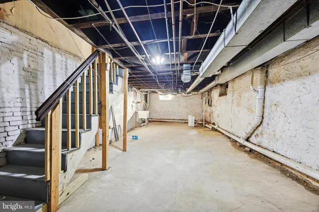 a view of an empty room with stairs