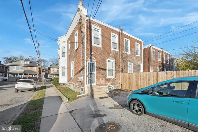 a front view of a house with parking area