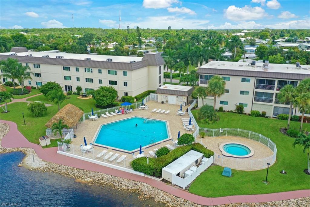 1010 Manatee Road, Unit B201 Naples, FL 34114 - Photo 15 of 24 an aerial view of a house with garden space and street view