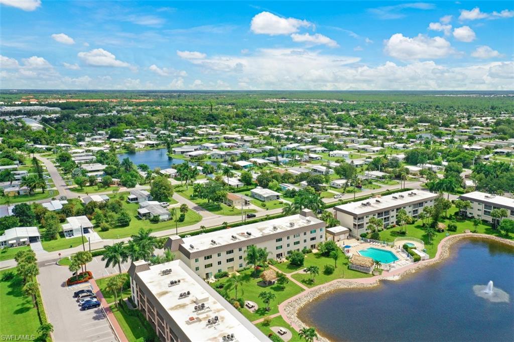 1010 Manatee Road, Unit B201 Naples, FL 34114 - Photo 17 of 24 an aerial view of residential houses with outdoor space and trees