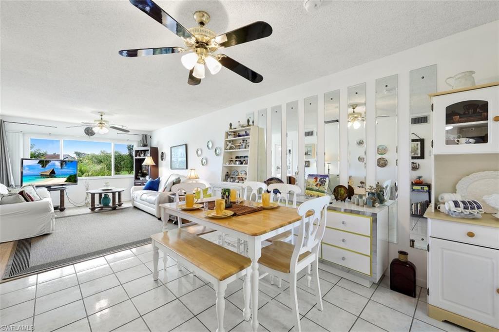 1010 Manatee Road, Unit B201 Naples, FL 34114 - Photo 9 of 24 a outdoor space with furniture and a large window