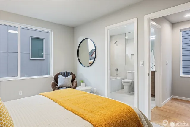 a bedroom with a bed and a mirror