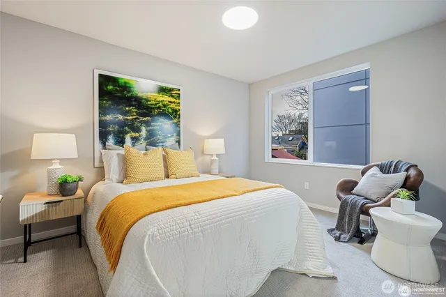 a bedroom with a bed and a couch