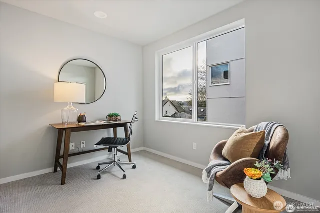 a view of workspace with a table and chairs