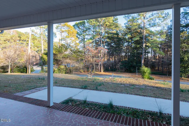 a view of a livingroom with furniture and a fireplace
