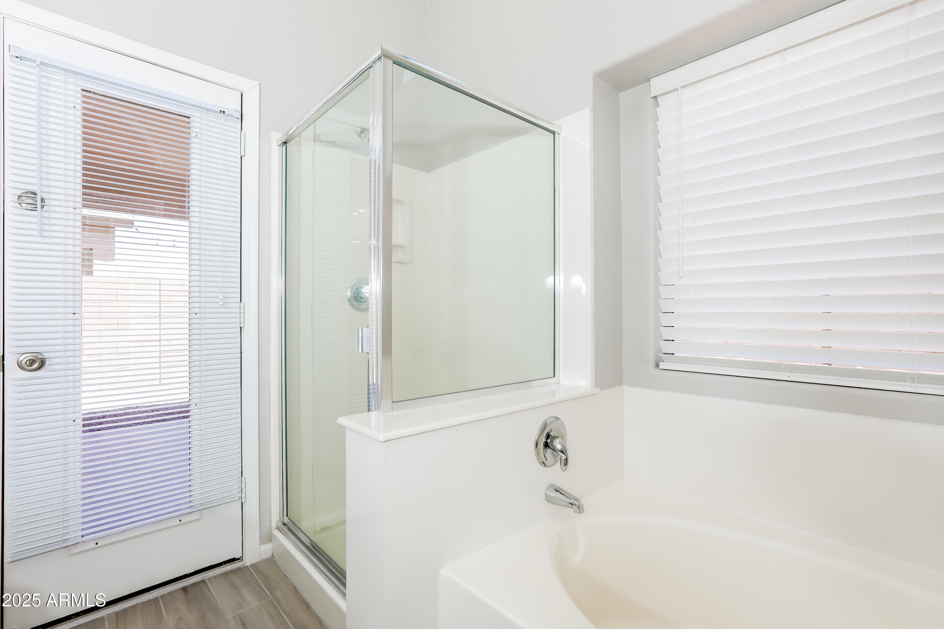 42430 Chambers Drive Maricopa, AZ 85138 - Photo 14 of 15 a bathroom with a bathtub and a shower