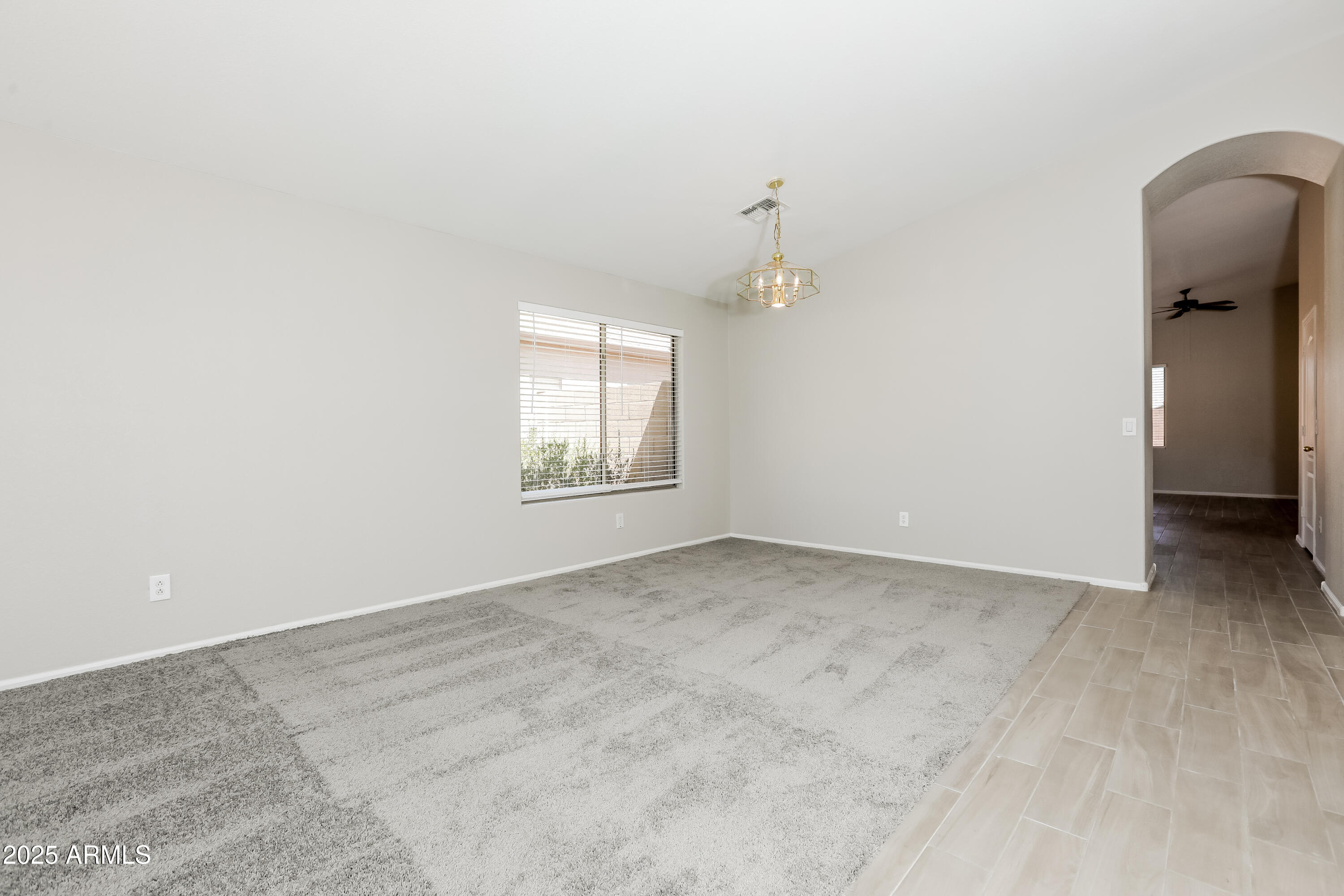 42430 Chambers Drive Maricopa, AZ 85138 - Photo 10 of 15 an empty room with windows