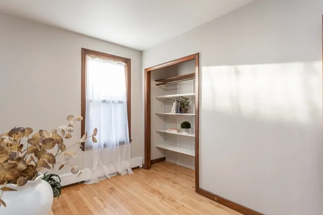 a view of bedroom with a bed and a window