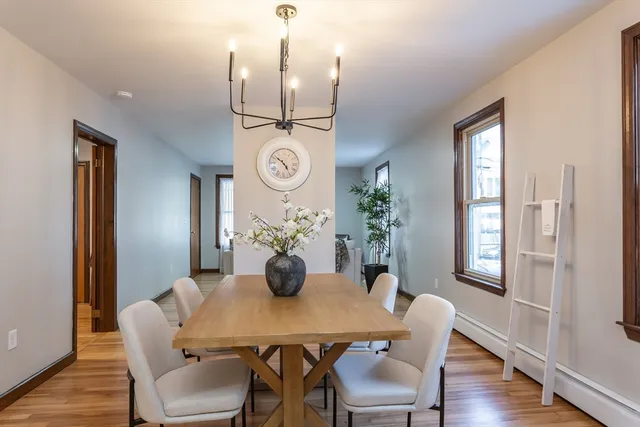 a view of a dining room with furniture window and wooden floor