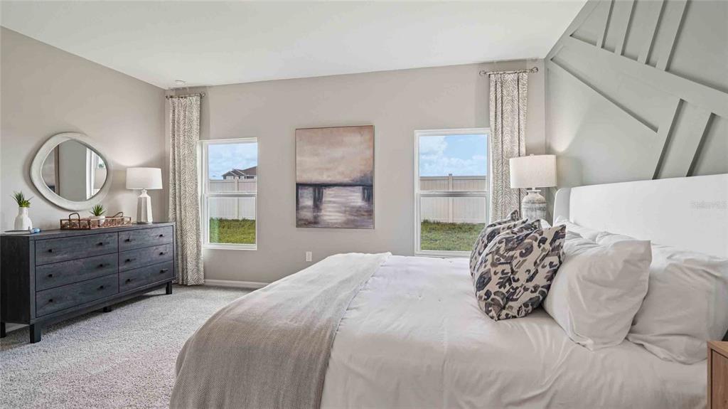 4623 Kona Circle Spring Hill, FL 34608 - Photo 11 of 25 a bedroom with a bed and a dresser
