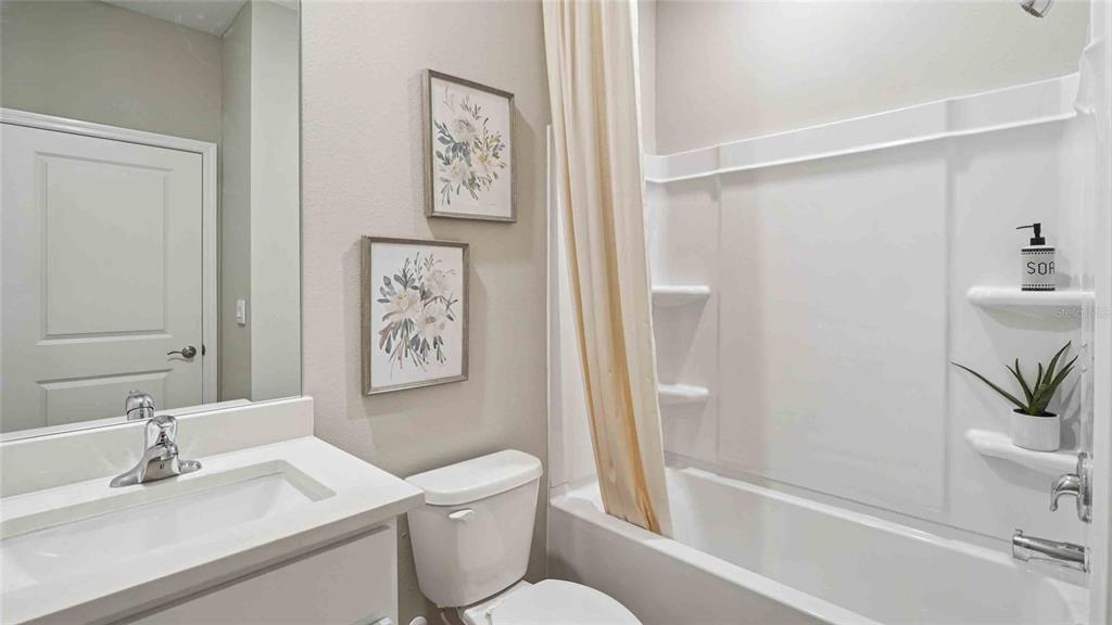 4623 Kona Circle Spring Hill, FL 34608 - Photo 17 of 25 a bathroom with a sink toilet and vanity