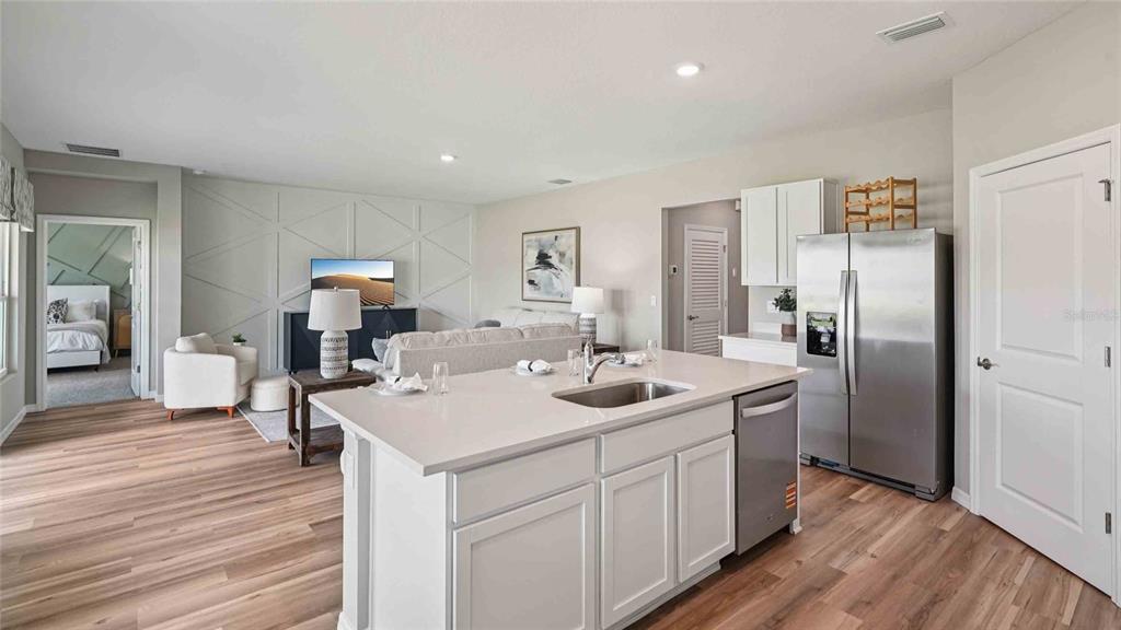 4623 Kona Circle Spring Hill, FL 34608 - Photo 5 of 25 a kitchen with a sink cabinets and wooden floor