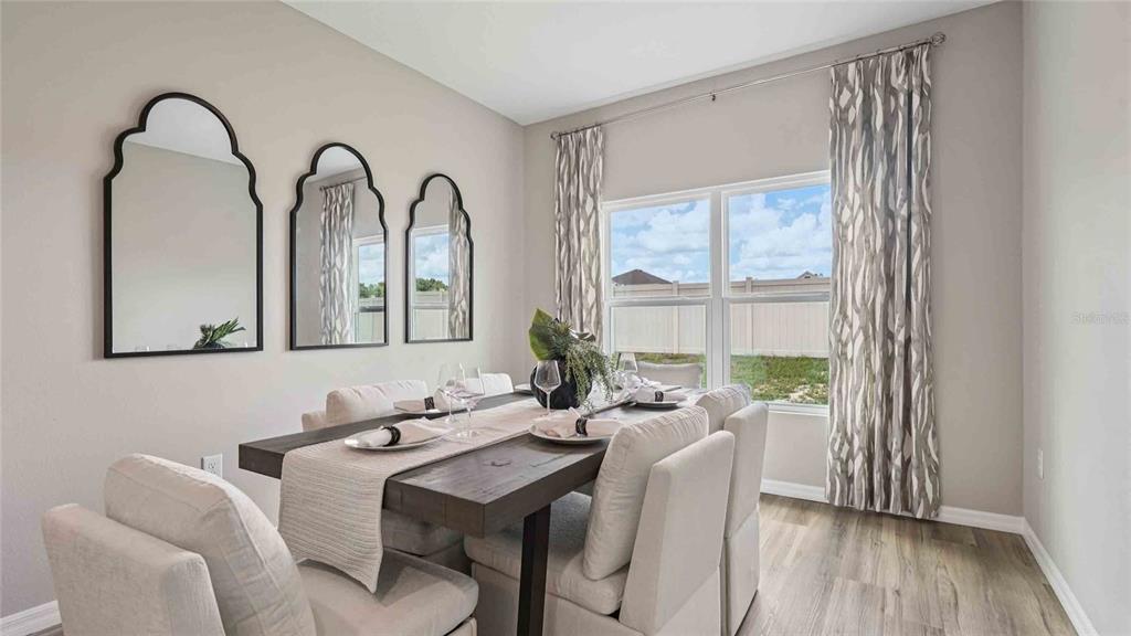4623 Kona Circle Spring Hill, FL 34608 - Photo 7 of 25 a view of a dining room with furniture window and wooden floor