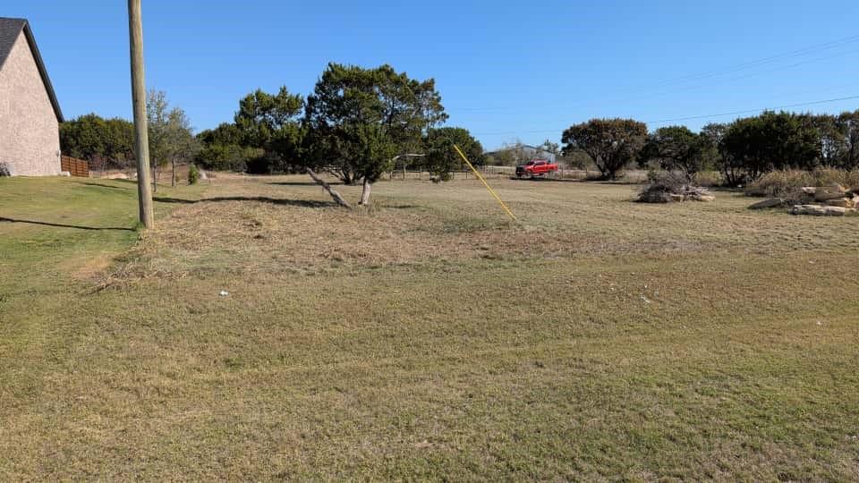 1004 County Road 407 Nemo, TX 76070 - Photo 3 of 5 a view of dirt yard with a large tree
