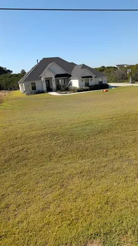 a view of a yard with mountain