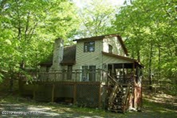 926 Canterbury Road Bushkill, PA 18324 - Photo 1 of 3 a view of a wooden house with a yard