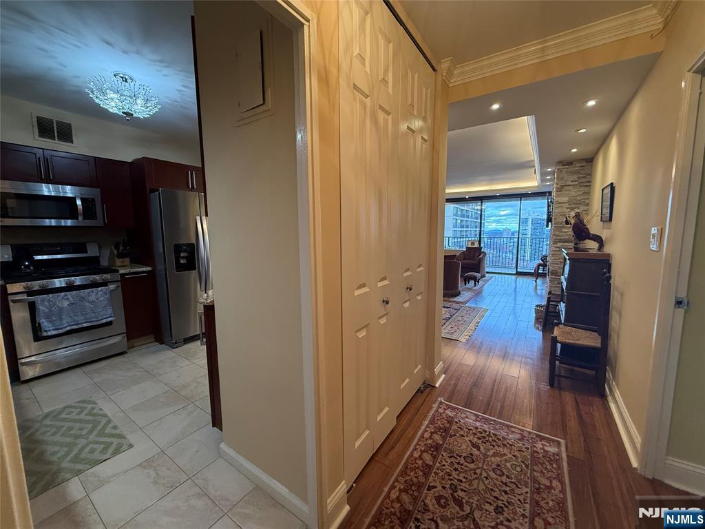 5 Horizon Road, Unit 2504 Fort Lee, NJ 07024 - Photo 12 of 41 a view of hallway with living room and furniture
