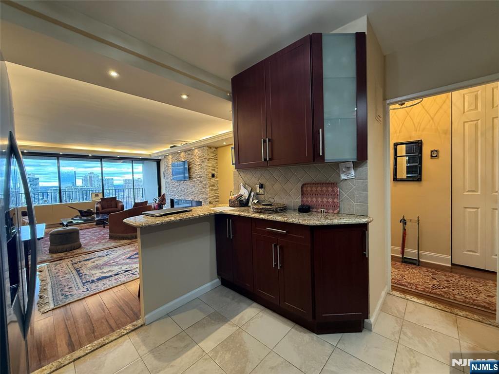 5 Horizon Road, Unit 2504 Fort Lee, NJ 07024 - Photo 14 of 41 a kitchen with granite countertop a sink and cabinets
