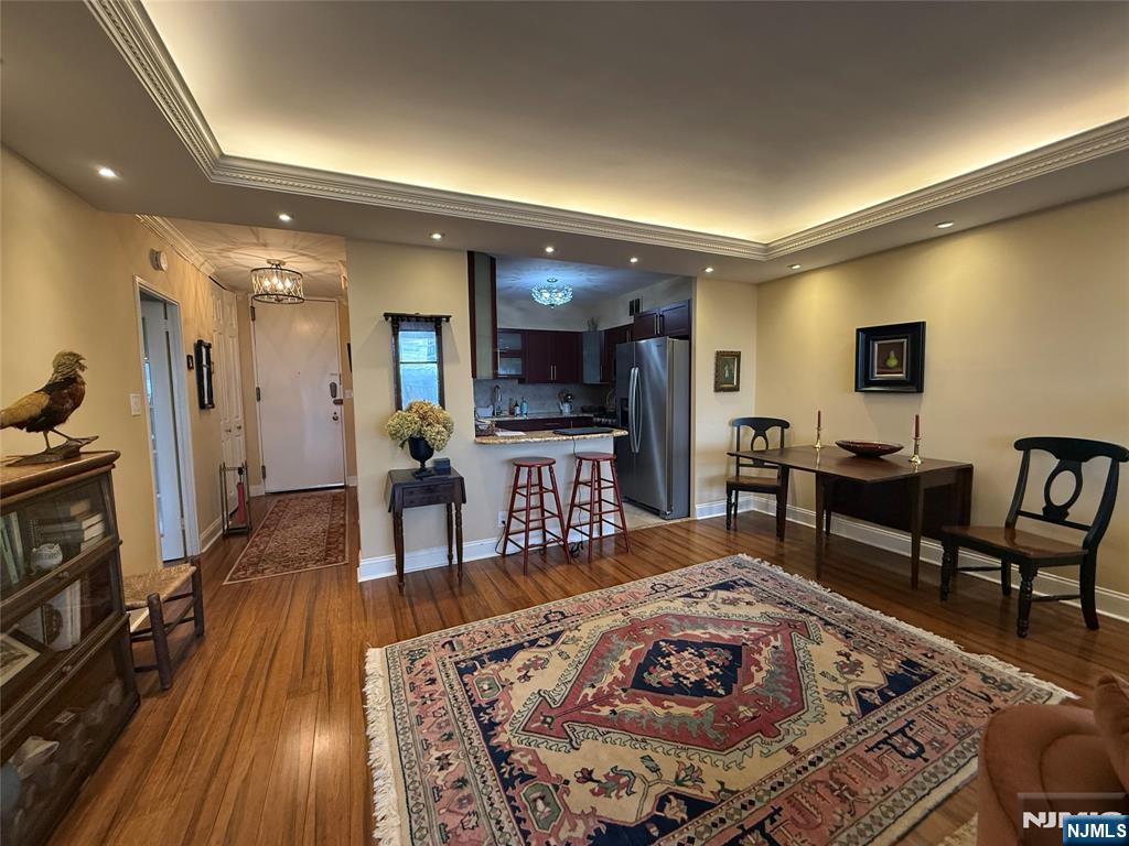 5 Horizon Road, Unit 2504 Fort Lee, NJ 07024 - Photo 16 of 41 a living room with furniture and a flat screen tv