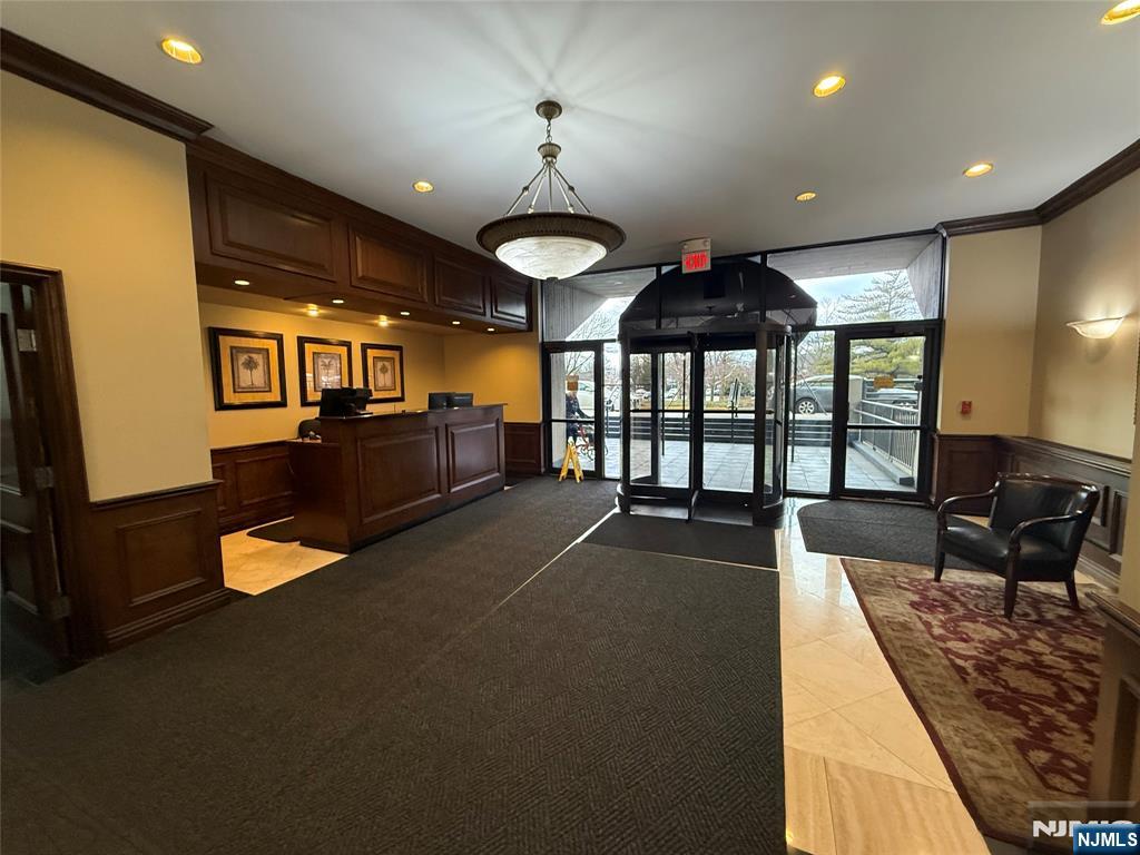5 Horizon Road, Unit 2504 Fort Lee, NJ 07024 - Photo 2 of 41 a living room with furniture and a large window