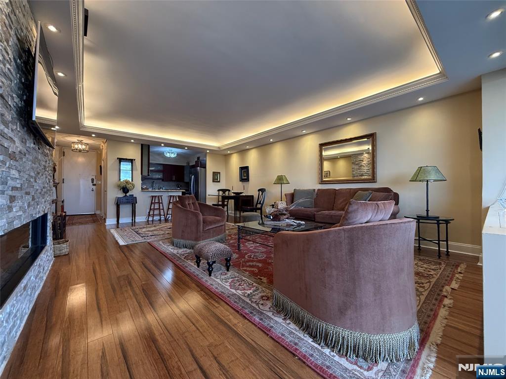 5 Horizon Road, Unit 2504 Fort Lee, NJ 07024 - Photo 21 of 41 a living room with furniture and a fireplace