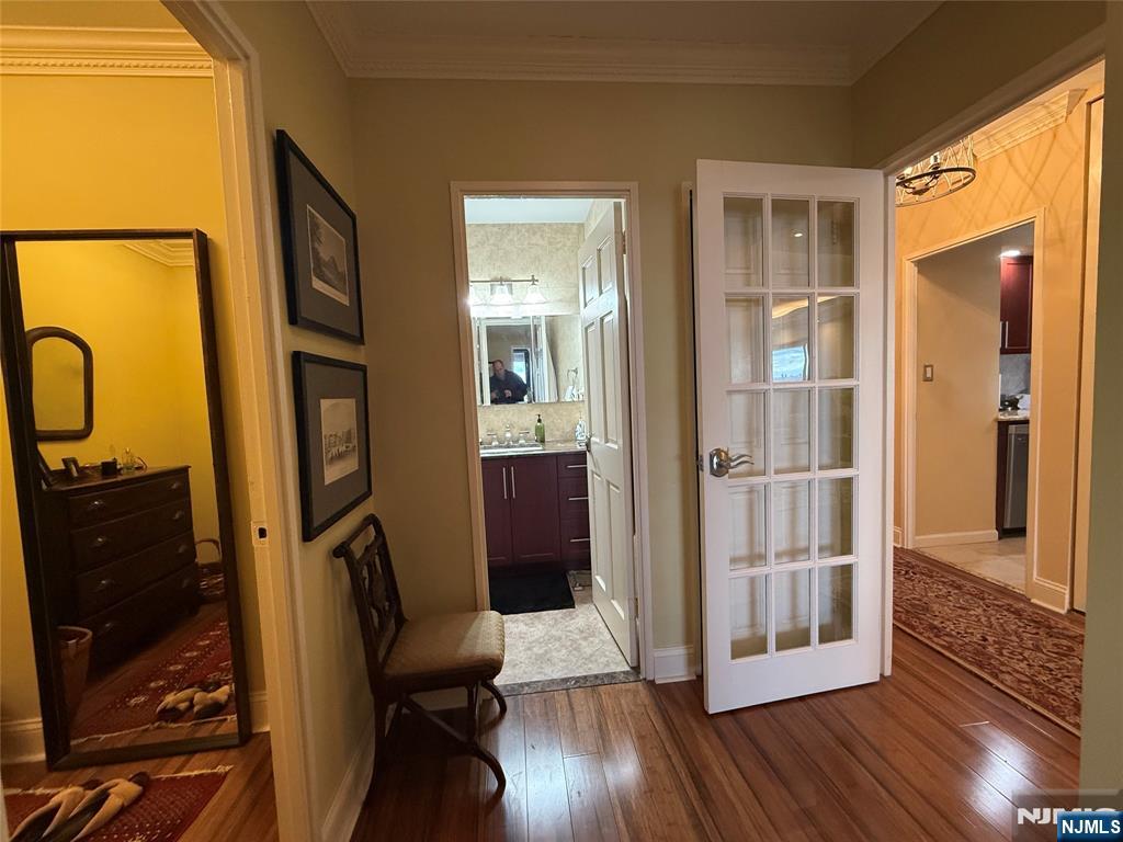 5 Horizon Road, Unit 2504 Fort Lee, NJ 07024 - Photo 32 of 41 a view of a bathroom with wooden floor and a glass door