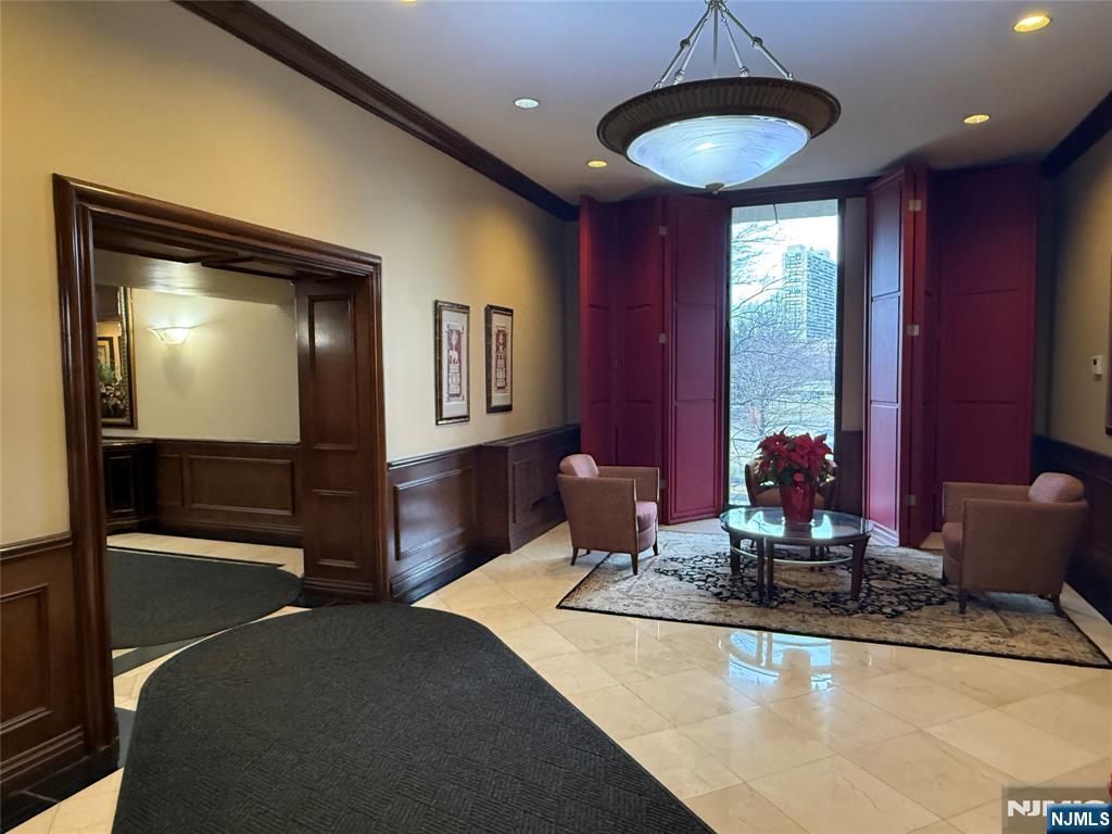 5 Horizon Road, Unit 2504 Fort Lee, NJ 07024 - Photo 6 of 41 a room with two chandeliers and furniture