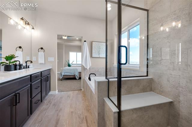 2970 Hoofprint Road Peyton, CO 80831 - Photo 25 of 42 Master Bath Shower With Seat