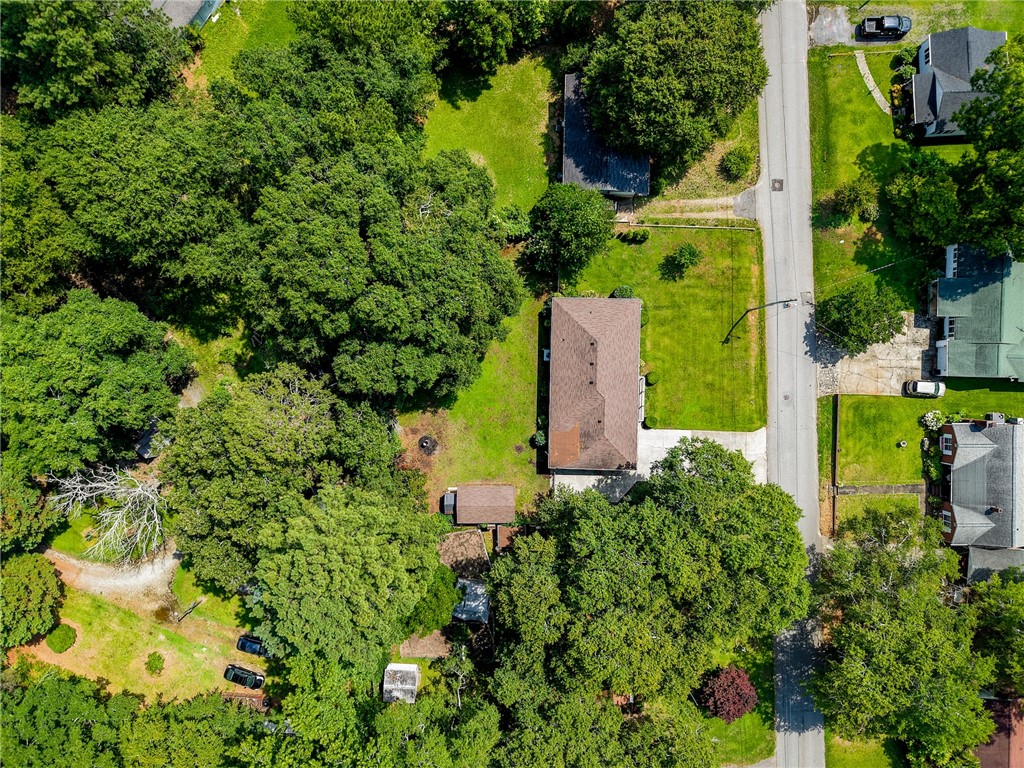 12 Dendy Street Pelzer, SC 29669 - Photo 28 of 31 An aerial perspective reveals a private, treed lot offering verdant surroundings and ample green space.