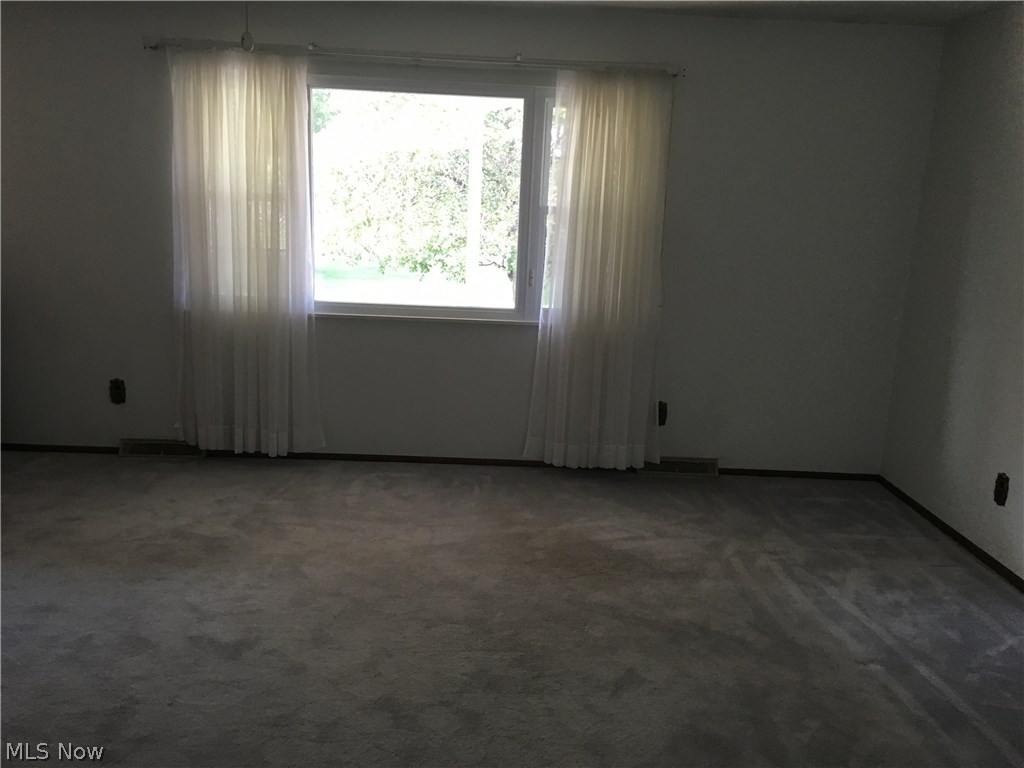 3137 Bates Road Madison, OH 44057 - Photo 12 of 17 Living room with view of the street. Very spacious living room.