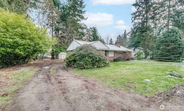a view of outdoor space with deck and yard
