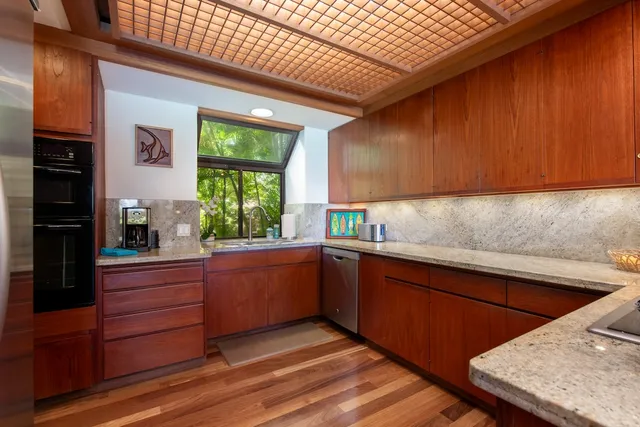 a kitchen with wooden cabinets and sink