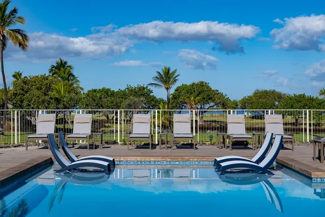a front view of a building with sitting area