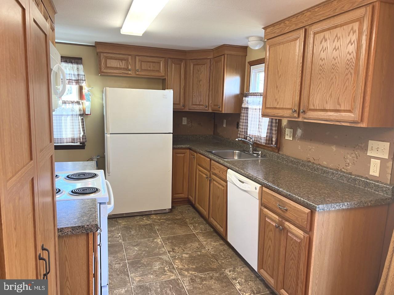 2722 Rowe Road New Windsor, MD 21776 - Photo 11 of 24 Kitchen with oak cabinets and ceramic tile floor