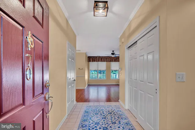 a view of an entryway with wooden floor