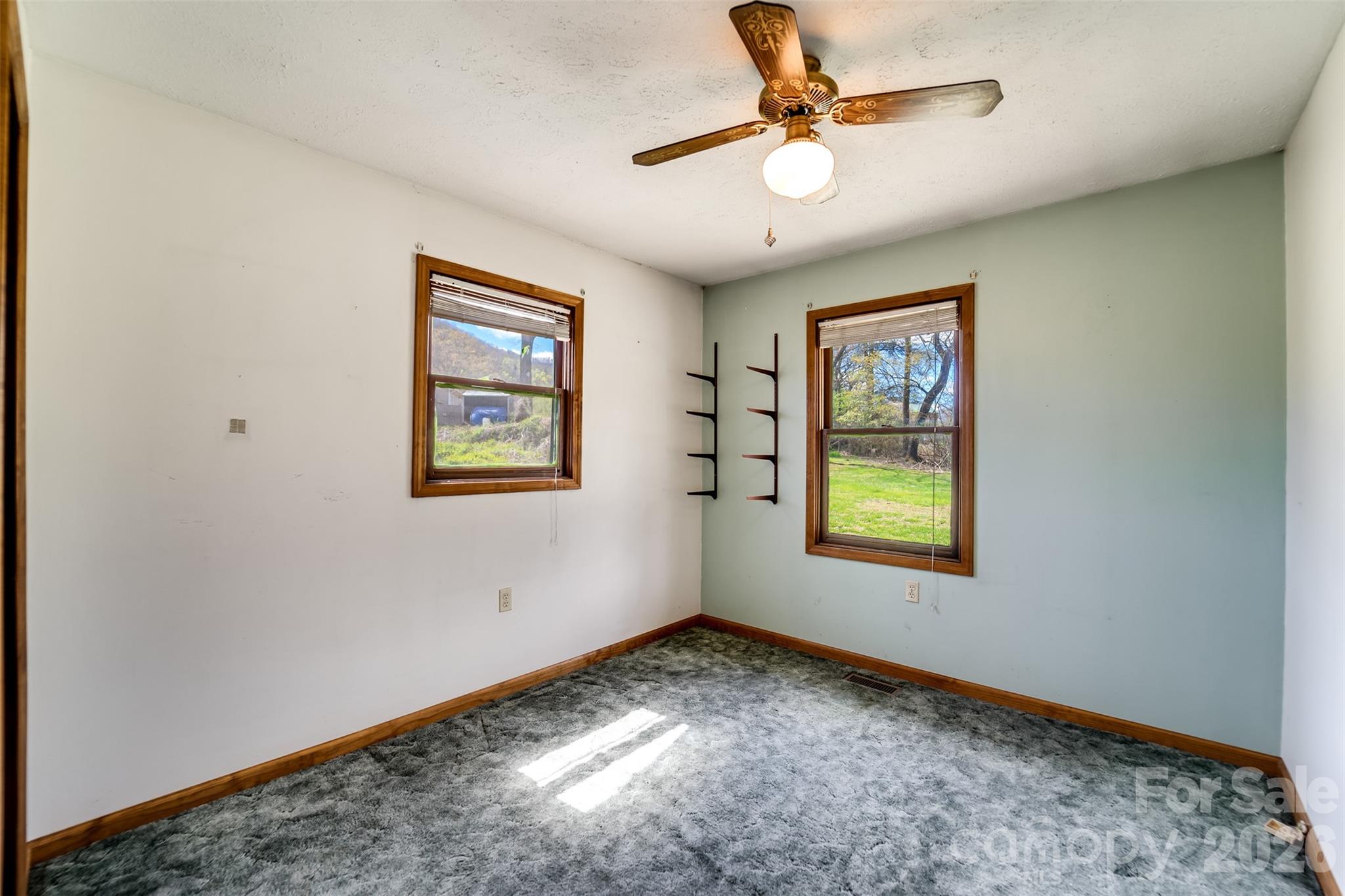 21 Queen Street Sylva, NC 28779 - Photo 14 of 45 wooden floor in an empty room with a window