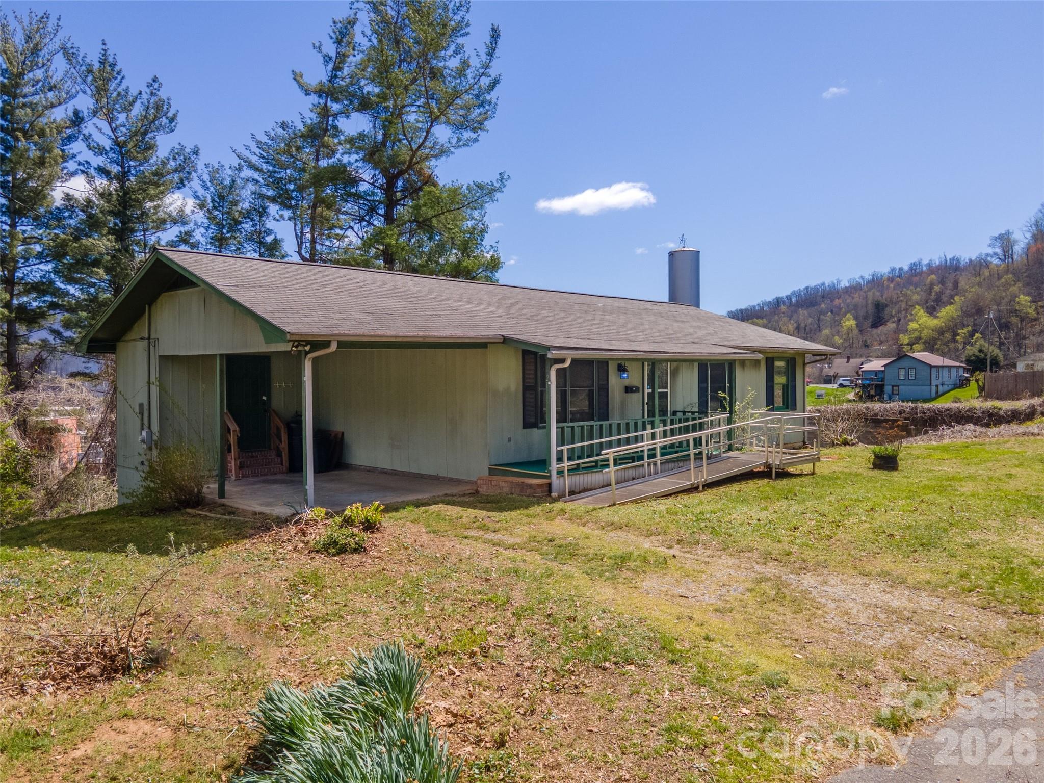 21 Queen Street Sylva, NC 28779 - Photo 2 of 45 a view of a house with a yard and sitting area