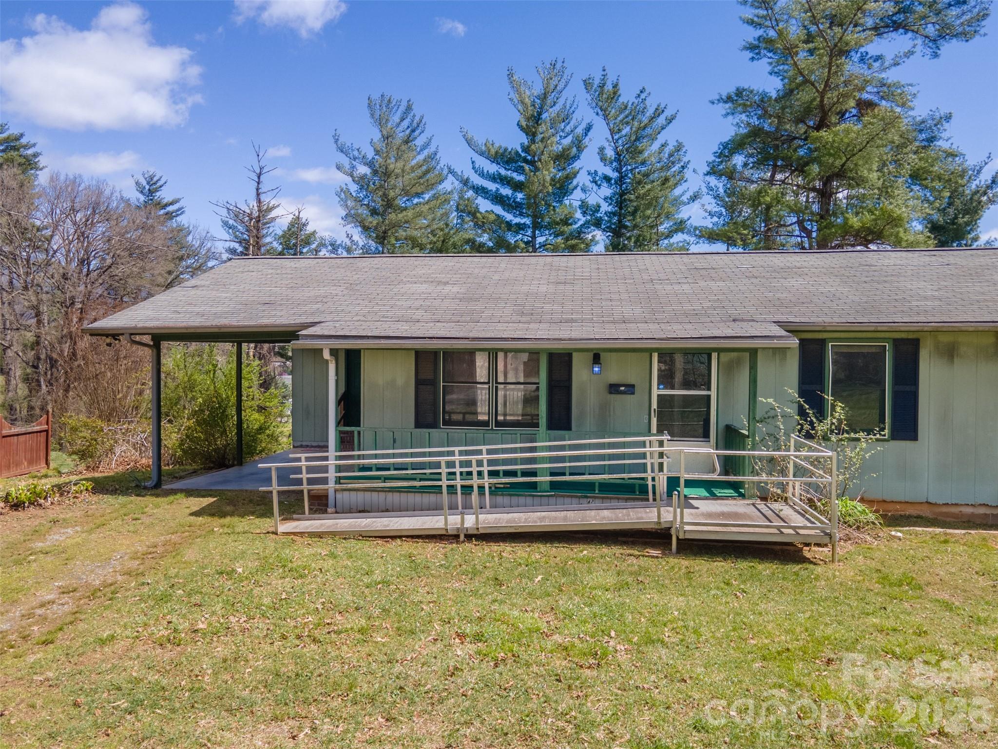21 Queen Street Sylva, NC 28779 - Photo 28 of 45 a front view of a house with garden