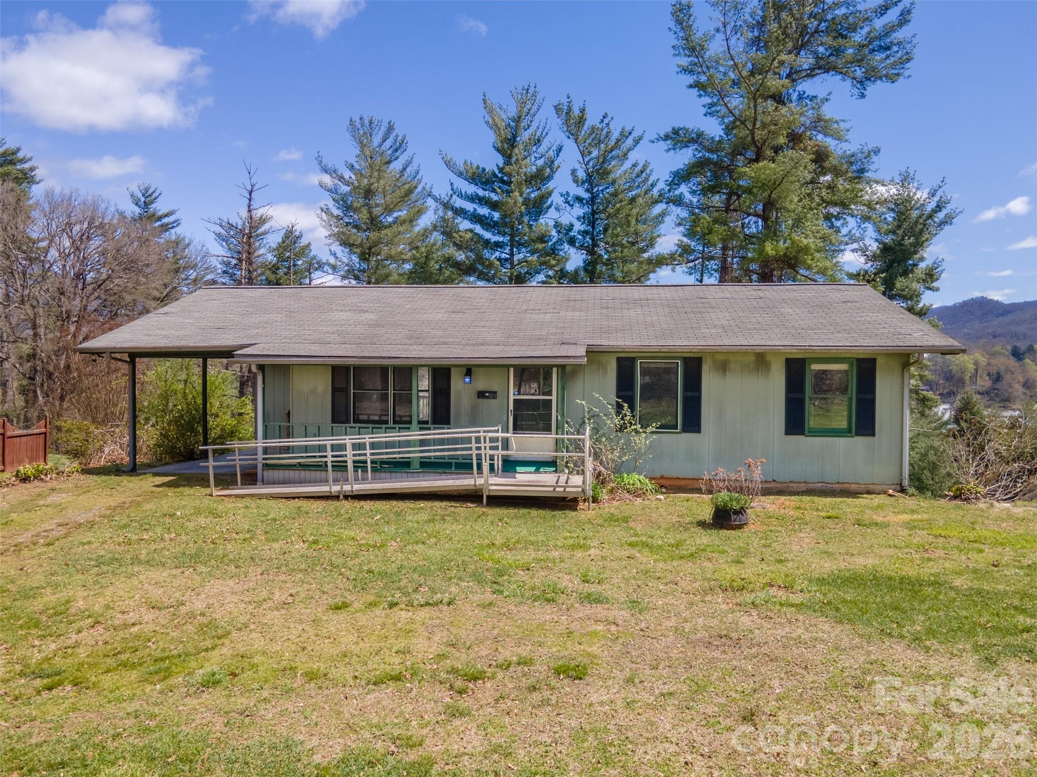 21 Queen Street Sylva, NC 28779 - Photo 3 of 45 a view of pool with table and chairs under an umbrella