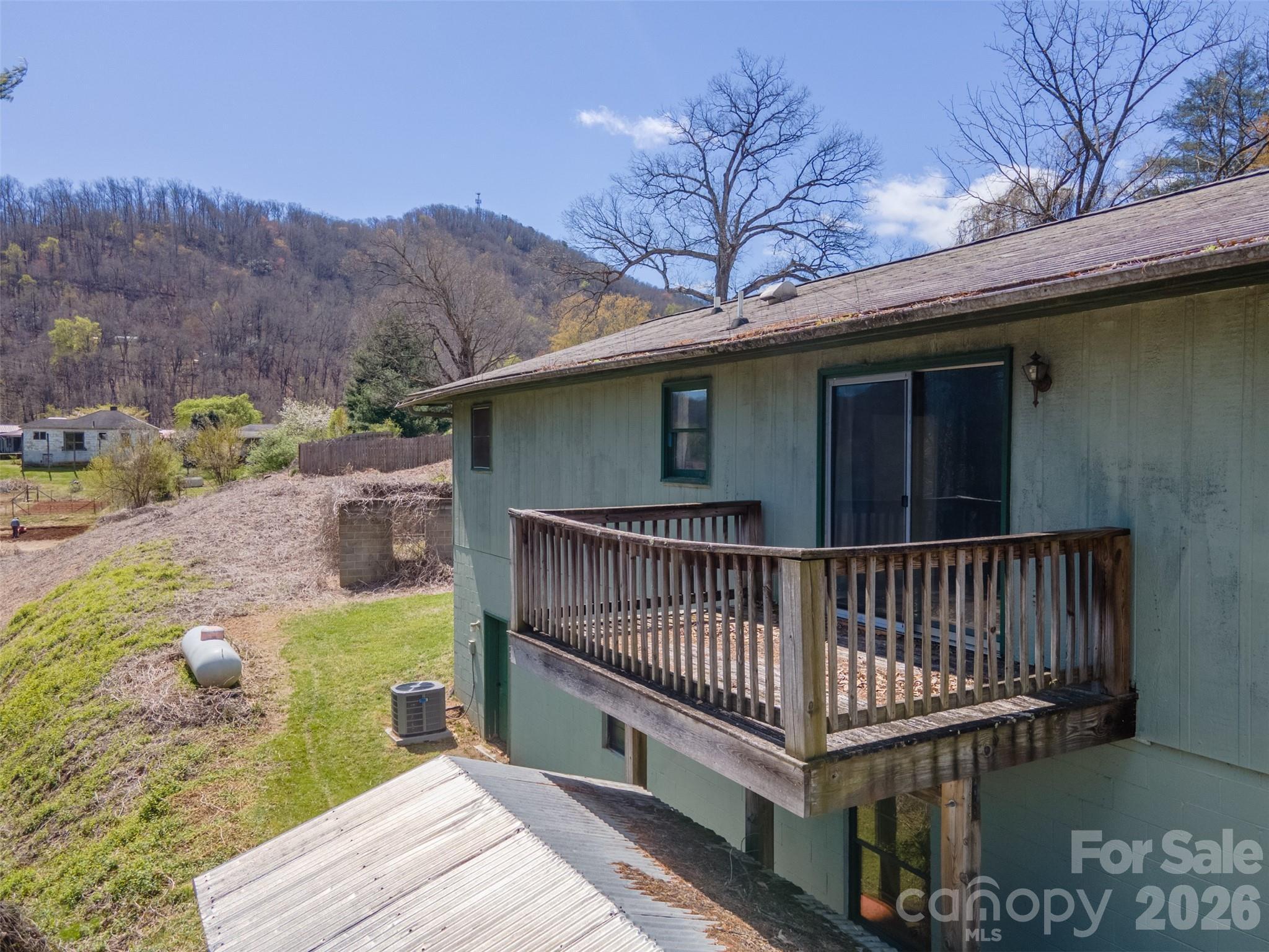 21 Queen Street Sylva, NC 28779 - Photo 33 of 45 a view of a roof deck with wooden floor and fence