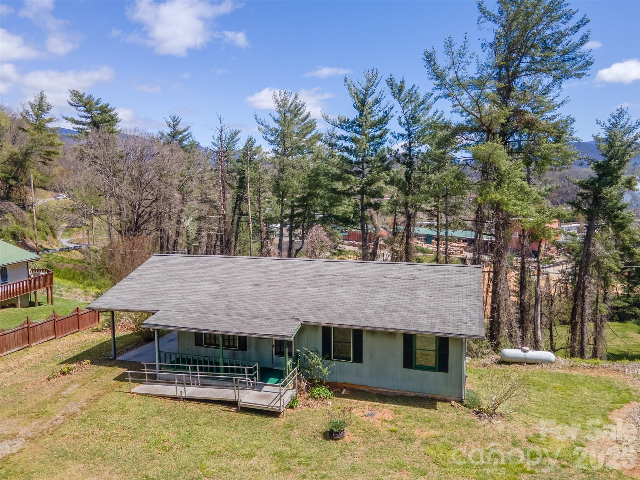 21 Queen Street Sylva, NC 28779 - Photo 34 of 45 a view of a dinning table and chairs in the patio