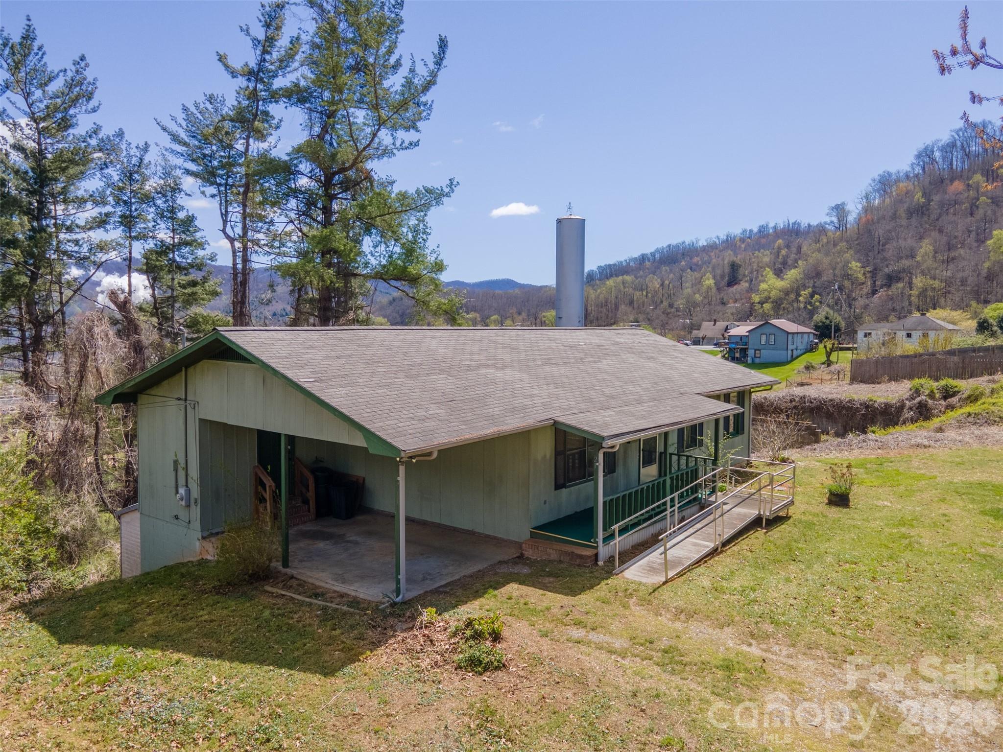 21 Queen Street Sylva, NC 28779 - Photo 35 of 45 a view of a house with a yard and roof