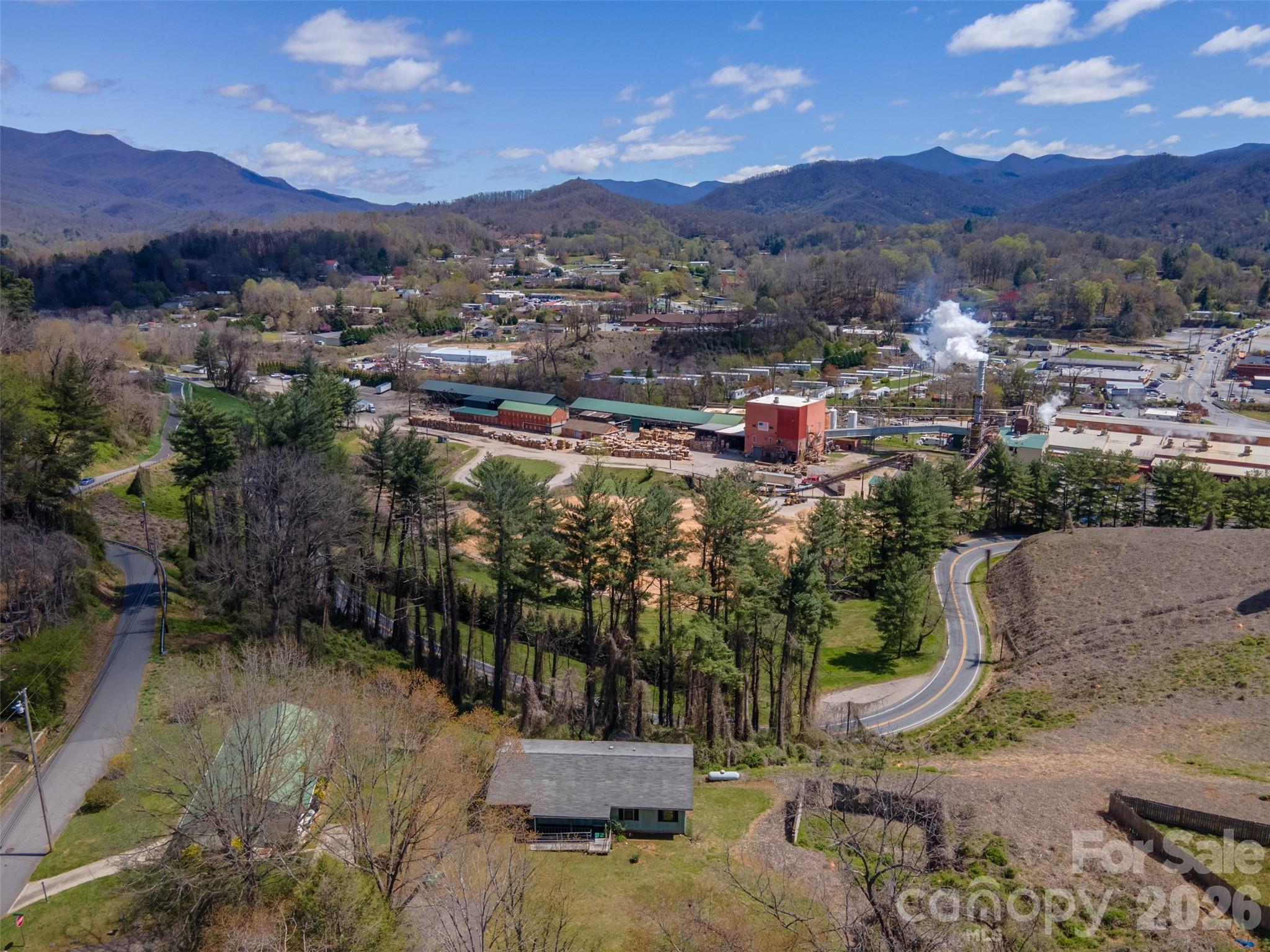 21 Queen Street Sylva, NC 28779 - Photo 40 of 45 a view of a town with mountains in the background