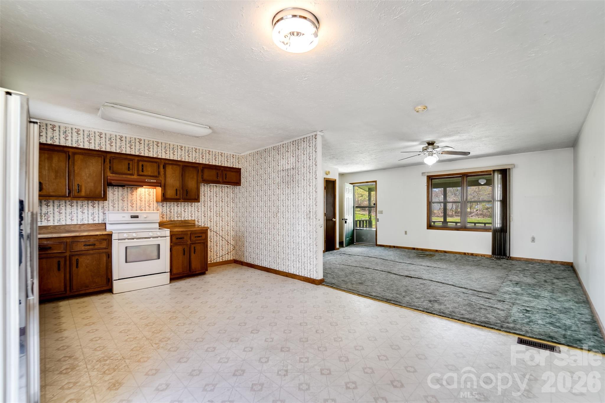21 Queen Street Sylva, NC 28779 - Photo 9 of 45 a view of an empty room with a kitchen